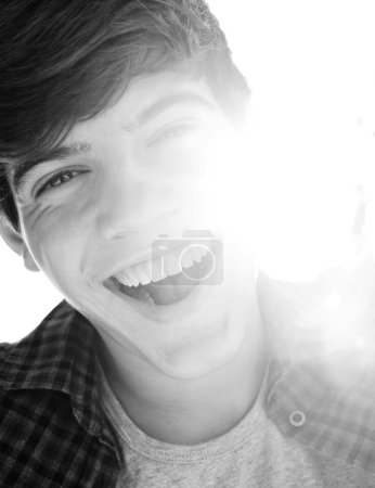 Portrait of a teenager boy joyfully laughing