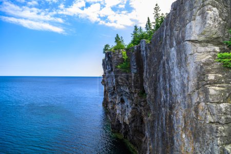 view of big long rocky cliff standing in cyprus lake against