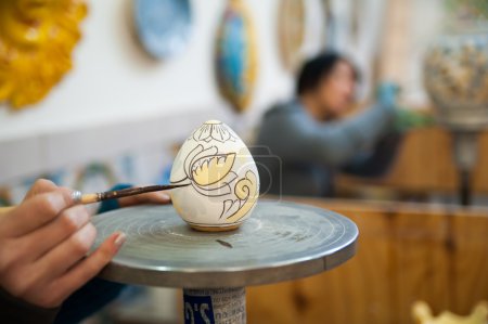 Ceramic egg being decorated