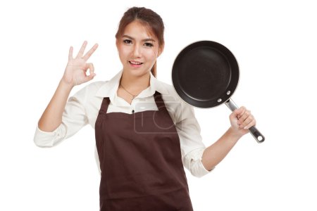 Asian girl cook show OK  with frying pan