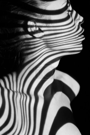 The face of woman with black and white zebra stripes